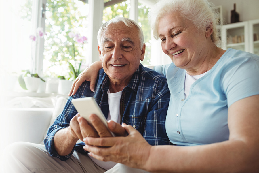 elderly couple on the phone